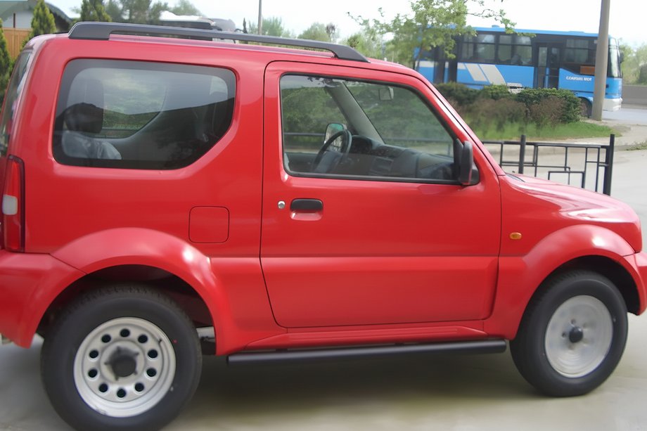 Suzuki Jimny 1998-2018 Barre Laterali Black (2 pz, acciaio inox) Image