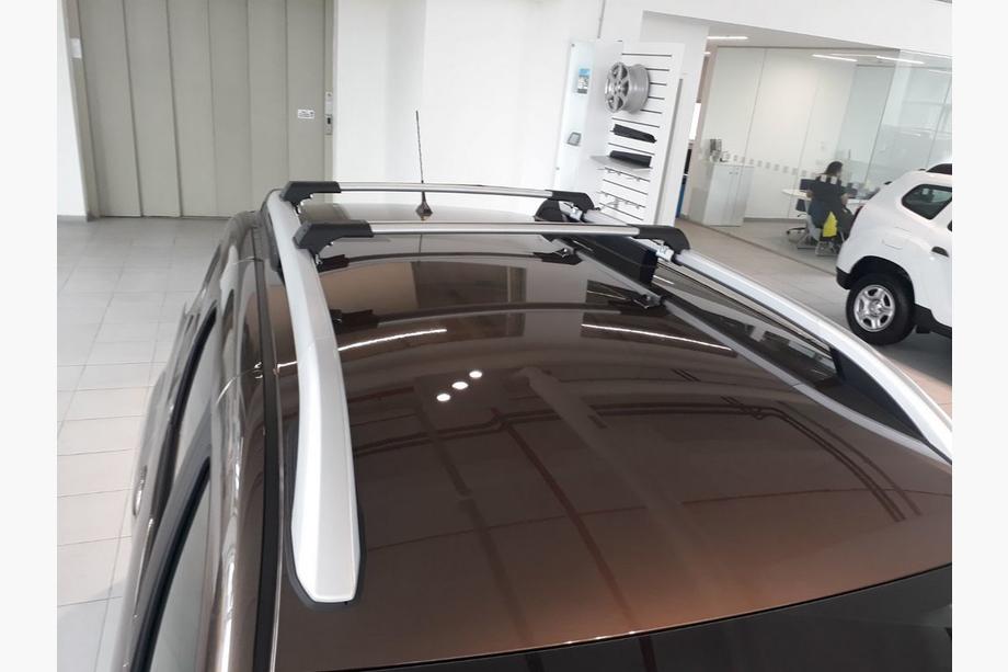 Dacia Duster 2018-2024 Barre portatutto per barre longitudinali integrate senza serratura (2 pz) Nero Foto 3